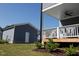 Backyard of a two-story home featuring a detached garage and covered porch at 201 Annabelle Blue Drive, Wake Forest, NC 27587