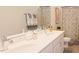 Bathroom features double sinks with quartz countertop and modern fixtures, exuding a clean, contemporary aesthetic at 201 Annabelle Blue Drive, Wake Forest, NC 27587