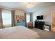 Serene bedroom featuring stylish decor, soft carpet, TV, and lots of natural light at 201 Annabelle Blue Drive, Wake Forest, NC 27587