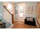 Charming entryway with hardwood floors, a staircase, and stylish decor at 201 Annabelle Blue Drive, Wake Forest, NC 27587