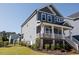 Two-story home with a covered porch, backyard and garden at 201 Annabelle Blue Drive, Wake Forest, NC 27587