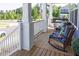 Cozy front porch featuring comfortable rocking chairs and a porch swing, creating a relaxing outdoor space at 201 Annabelle Blue Drive, Wake Forest, NC 27587