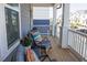 Inviting front porch featuring cozy seating, perfect for relaxing and enjoying the neighborhood views at 201 Annabelle Blue Drive, Wake Forest, NC 27587