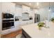 Well-equipped kitchen featuring white countertops, modern appliances, and ample cabinet space at 201 Annabelle Blue Drive, Wake Forest, NC 27587