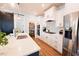 Bright kitchen featuring an island with barstool seating, stainless appliances, and a pantry at 201 Annabelle Blue Drive, Wake Forest, NC 27587