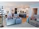 Spacious open-concept living area showcases stylish seating, modern lighting, and seamless flow to the kitchen at 201 Annabelle Blue Drive, Wake Forest, NC 27587