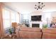 Bright living room showcasing comfortable seating, a fireplace, and stylish decor accents at 201 Annabelle Blue Drive, Wake Forest, NC 27587