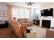 Inviting living room with plush seating, modern lighting, and a cozy fireplace at 201 Annabelle Blue Drive, Wake Forest, NC 27587