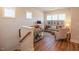 Upstairs living area features a comfortable seating area with natural light and stylish decor at 201 Annabelle Blue Drive, Wake Forest, NC 27587