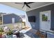 Relaxing covered patio with ceiling fan, outdoor seating, and convenient access to the backyard at 201 Annabelle Blue Drive, Wake Forest, NC 27587