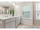 Modern bathroom with double sinks, large mirror, and a glass-enclosed shower at 207 Curling Creek Dr # 300P, Clayton, NC 27527