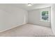 Comfortable bedroom featuring neutral carpeting and a sunlit window at 207 Curling Creek Dr # 300P, Clayton, NC 27527