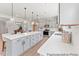 Spacious kitchen featuring a large center island, modern light grey cabinets and countertops at 207 Curling Creek Dr # 300P, Clayton, NC 27527