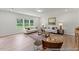 Bright and open living room with lots of natural light, wood floors and comfortable couches at 207 Curling Creek Dr # 300P, Clayton, NC 27527