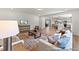 Inviting living room with an open floor plan, seamlessly connecting to the kitchen and dining area at 207 Curling Creek Dr # 300P, Clayton, NC 27527