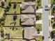 Aerial view showcases the property's location within a neighborhood with mature trees and green spaces at 212 Crisp Rd, Durham, NC 27713