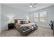 Comfortable bedroom with neutral tones, plush carpet, and a large window for natural light at 212 Crisp Rd, Durham, NC 27713