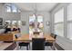 Bright dining area features a modern chandelier, views to the back yard, and access to the back patio at 212 Crisp Rd, Durham, NC 27713