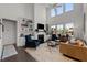 Spacious living room with built-in bookshelves, gas fireplace, high ceilings, and lots of natural light at 212 Crisp Rd, Durham, NC 27713