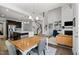 Open-concept living area with a kitchen, dining space, stairs, and a cozy living room with a fireplace at 212 Crisp Rd, Durham, NC 27713