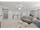 Upstairs loft area with comfortable seating, neutral carpet, and great natural light at 212 Crisp Rd, Durham, NC 27713