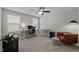 Bright home office with desks, comfortable seating, a floor lamp, and lots of natural light at 212 Crisp Rd, Durham, NC 27713