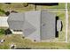 Aerial view of a home showing the roof, fenced yard, and surrounding landscape at 214 Dogwood Blossoms Dr, Durham, NC 27703