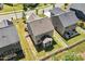 Aerial view of the backyard with a patio and white picket fence at 214 Dogwood Blossoms Dr, Durham, NC 27703