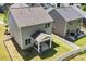 Backyard view with covered patio area, green grass, and white picket fence at 214 Dogwood Blossoms Dr, Durham, NC 27703