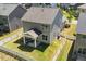 Aerial view of backyard featuring a covered patio and a neatly fenced yard at 214 Dogwood Blossoms Dr, Durham, NC 27703