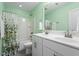 Bathroom featuring double sinks, tile floors, shower with glass door and leafy shower curtain at 214 Dogwood Blossoms Dr, Durham, NC 27703