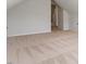 Spacious carpeted bedroom featuring a bright, open doorway and neutral decor at 214 Dogwood Blossoms Dr, Durham, NC 27703