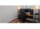 Small bedroom area with computer desk and chair, hardwood floors, and sleek design at 214 Dogwood Blossoms Dr, Durham, NC 27703