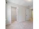 Carpeted bedroom with closet and entrance to another area at 214 Dogwood Blossoms Dr, Durham, NC 27703