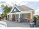 Community clubhouse with stone columns and a charming front entrance next to the pool at 214 Dogwood Blossoms Dr, Durham, NC 27703
