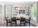 A stylish dining room is set for a meal, and decorated with a beautiful arrangement of wall art at 214 Dogwood Blossoms Dr, Durham, NC 27703