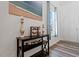 Stylish entryway featuring a decorative table, beach painting and a view to the entry door at 214 Dogwood Blossoms Dr, Durham, NC 27703