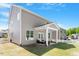Back of home showcasing outdoor patio and yard with white picket fence at 214 Dogwood Blossoms Dr, Durham, NC 27703
