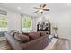 Inviting living room showcasing comfortable seating, a modern TV stand, and bright windows at 214 Dogwood Blossoms Dr, Durham, NC 27703