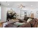Spacious living room with neutral walls, hardwood floors, comfortable seating and a media center at 214 Dogwood Blossoms Dr, Durham, NC 27703