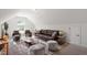Inviting living room under slanted ceiling with stylish seating, lamps and modern decor at 214 Dogwood Blossoms Dr, Durham, NC 27703