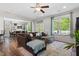 Cozy living room featuring a comfortable sofa, bright windows and hardwood style floors at 214 Dogwood Blossoms Dr, Durham, NC 27703