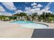 Outdoor community pool with lounge chairs and clear blue water at 214 Dogwood Blossoms Dr, Durham, NC 27703