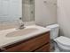 Bathroom featuring a sink, toilet, and a wood vanity at 235 Michigan Ave, Cary, NC 27519