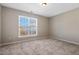 Carpeted bedroom featuring a large window at 235 Michigan Ave, Cary, NC 27519