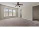 Bedroom with ceiling fan and carpet and view to closet and bath at 235 Michigan Ave, Cary, NC 27519