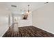 Bright dining area open to kitchen and featuring stylish light fixtures at 235 Michigan Ave, Cary, NC 27519