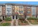 Charming multi-story townhomes with well-maintained landscaping and inviting front entrances at 235 Michigan Ave, Cary, NC 27519