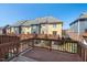 View of townhomes from deck featuring colorful exterior and blue skies at 235 Michigan Ave, Cary, NC 27519