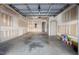 Unfinished garage interior with gray concrete floor and unfinished walls at 235 Michigan Ave, Cary, NC 27519